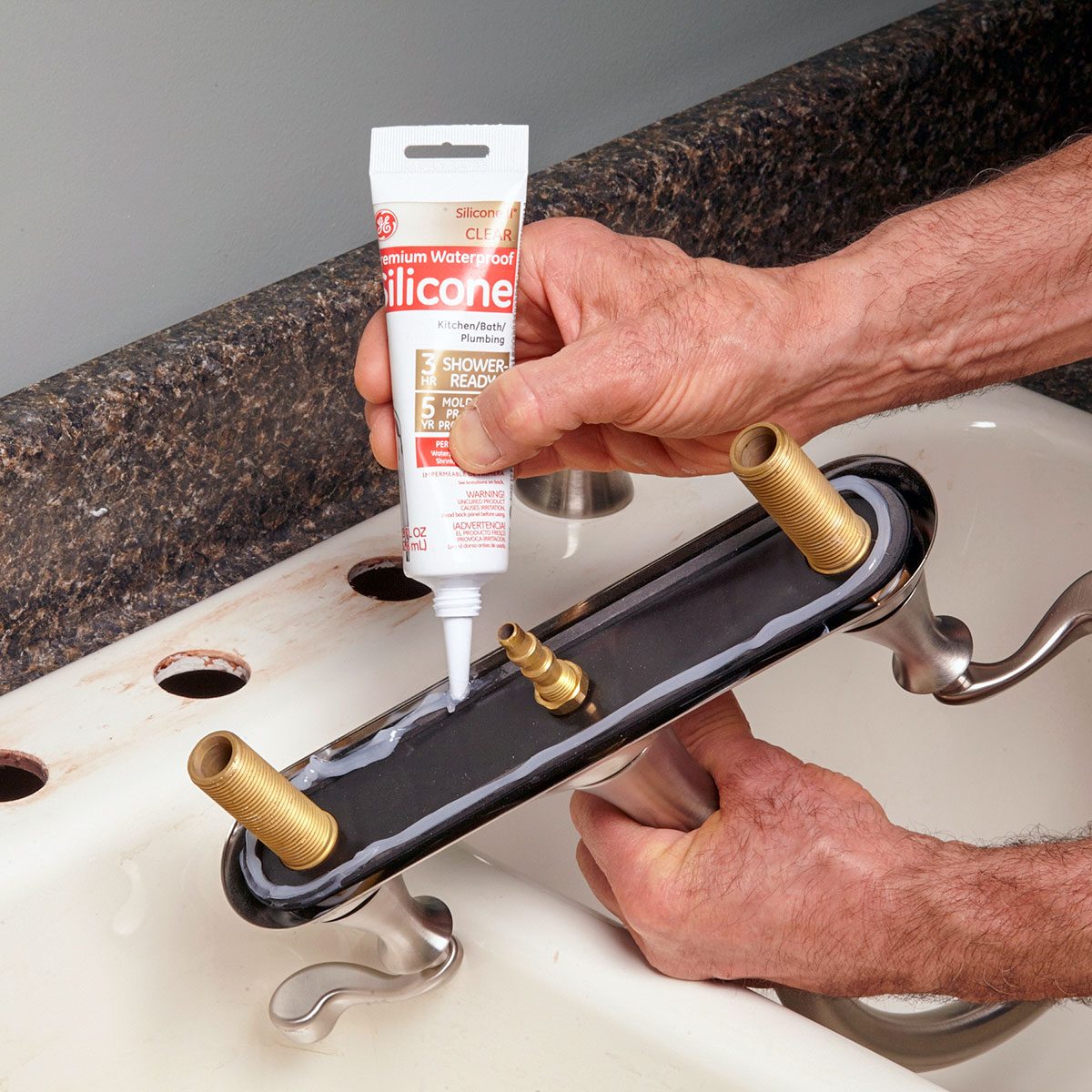 Applying silicon on faucet base