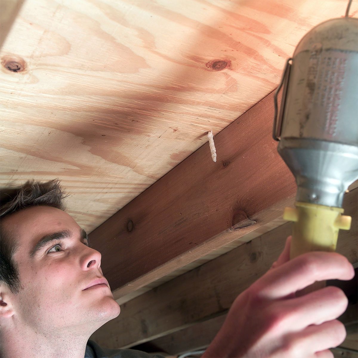 A man working in attic