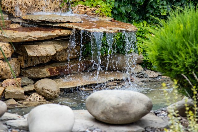 A small decorative waterfall in the Park or in the garden. Landscape design